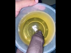Yellow color pee in cup in the morning 