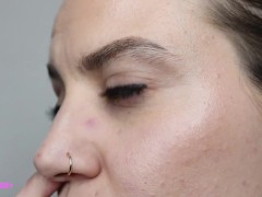 Pretty girl plays with nose nostrils picking nose