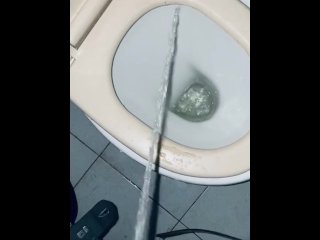 pissing in a dirty bathroom