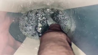 Pissing into a huge bucket at home
