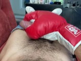 Gay jerking off with boxing gloves.