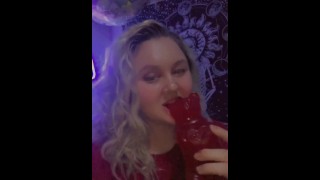 seductive teen takes a bite out of a giant gummy bear