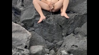 Me pissing on my feet on the rocks