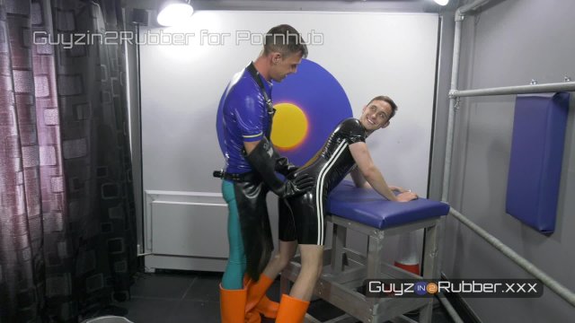 Two guys in tight shiny rubber & orange boots arse fingering, jerking each other, dildos, rimming