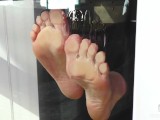 My barefoot wrinkled soles rubbing against the glass and squeezing juicy strawberries