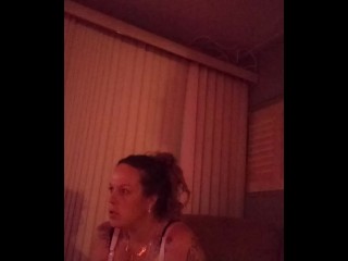 Milf with big boobs showing off cleavage_while playing_video games and smoking at same time