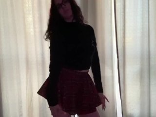 Dancing a sexy striptease.