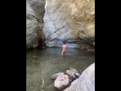 Naked at the river. 