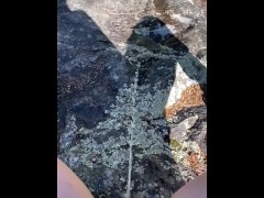Pissing on the rocks by the river