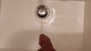 Taking a leak in the sink at work