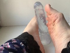 foot fetish. beautiful legs and a transparent dildo
