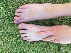 Playing with my feet and dirty toenails outside on grass