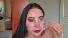 Red lips slut playing with her own spit as she gags on her own hand and a dildo | blowing bubbles