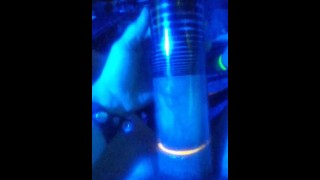 pumping dick and balls into penis pump under blue light