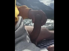 Hot guy jerking off in public with a stunning view