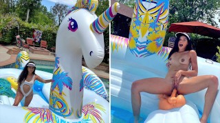 Busty Hot Brunette Masturbates On Giant Unicorn Float