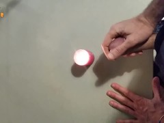 Homemade handjob with cumshot on a candle, big cock and big load, jerking off on the flame