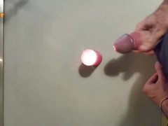 Homemade handjob with cumshot on a candle