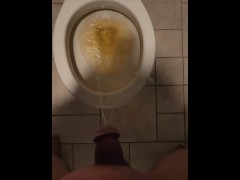 Messy piss fountain into the toilet