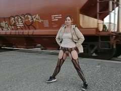 Flashing kitty in front of a passing train