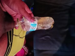 Peeing in a water bottle 
