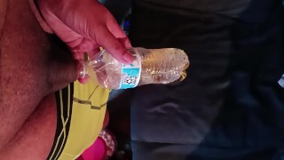 Peeing in a water bottle 