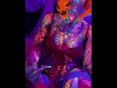 girl sticks tongue out covered in paint 