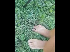 Dirty feet walking in the grass *end of the day