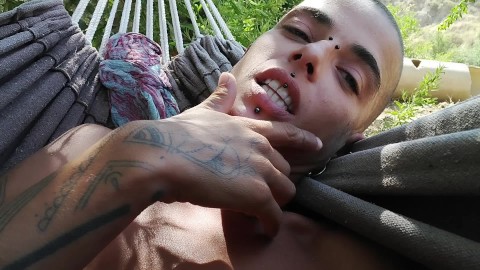 On the hammock. I lick my hairy armpits and play whit my asshole.