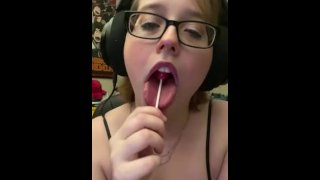 Playfully Licking a Lollipop