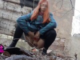 Desperate Redhead peeing in the forest ruins.
