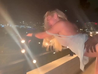 Blonde slut takes huge BBC in her throat and gets railed on the railing of her balcony 