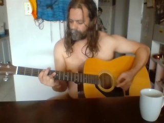Naked guy playing guitar