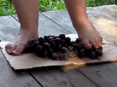 MILF tramples grapes with her bare feet.