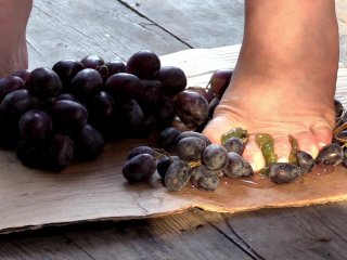 MILF tramples grapes with her bare feet.