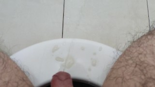Sitting on the toilet and pissing all over the floor