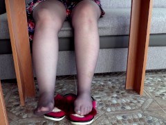Nylon legs under the table.