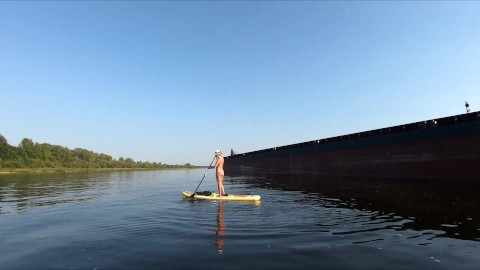 Nude Girl swam on Sup Board