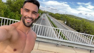 Fit guy gets naked next to a highway on a bridge. Very Risky!