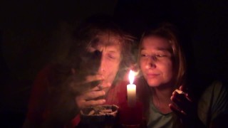 Couple smoking next to candle