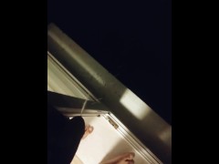 a guy pees out a window in public