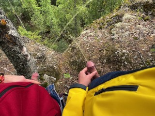 Two Tight Streams of Urine Cross in the Mountains. Pissing Outdoor UHD 4K Video