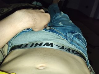 Guy in jeans and with a big dick masturbates