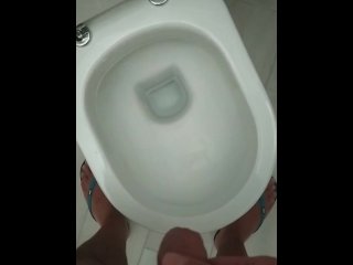 A beautiful pee in a public toilet with hard cook