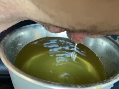 Pissing in a dog bowl for fun