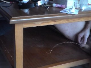 John is Pissing on the Table Shelf