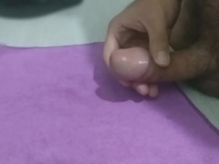 Cumming on top of a purple fabric