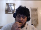 disheveled fat Arab man eats chicken nuggets.