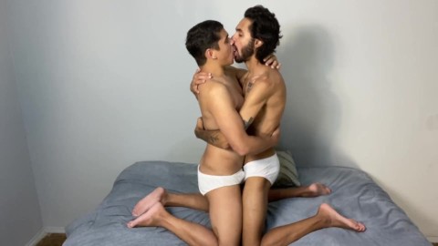 Two boys kissing in white underwear
