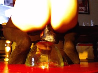 Riding some huge dildos